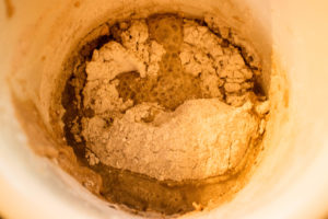 Looking down into the sourdough prior to stirring in fresh rye flour.