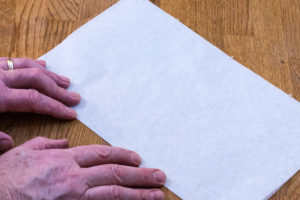 Step 1: Fold the paper for the cartouche in half.
