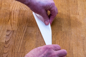 Step 4: Repeat folding the cartouche making it into a narrow triangle.