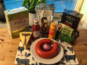 What you'll need for this recipe. Falukorv, onion, chili sauce, mustard and cheese.