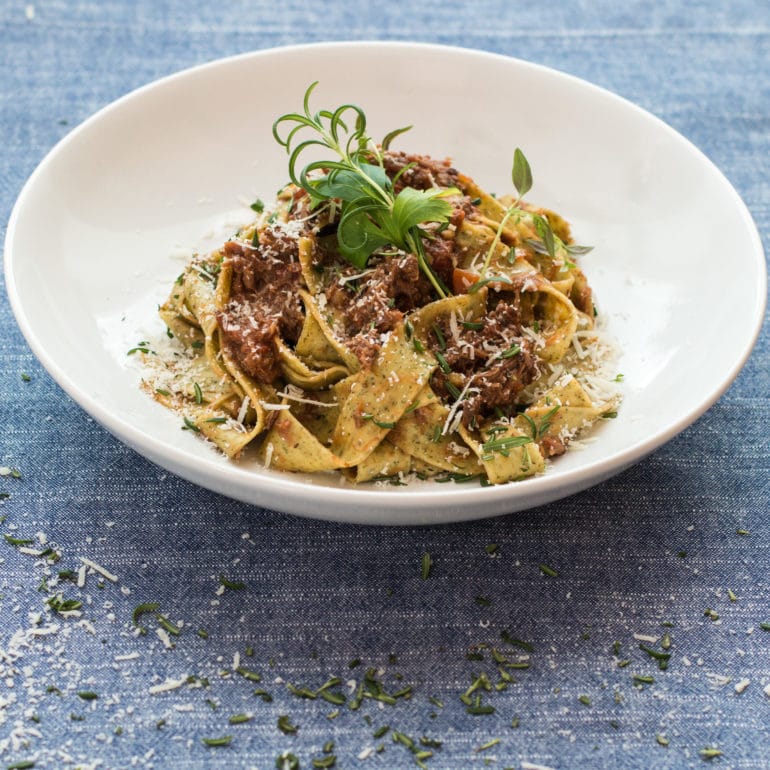 Pappardelle and Italian Lamb Ragout plated and ready to eat.