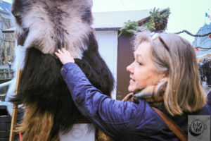 Eva inspecting fur pelts.