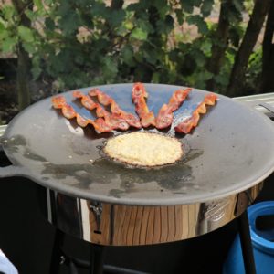 Raggmunk and cured pork belly frying on the Muurikka.