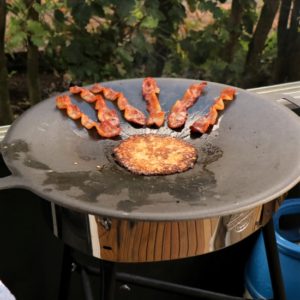 Raggmunk and cured pork belly frying on the Muurikka.