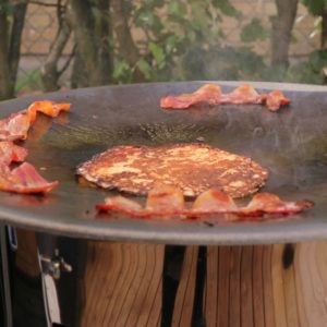Raggmunk and cured pork belly frying on the Muurikka.