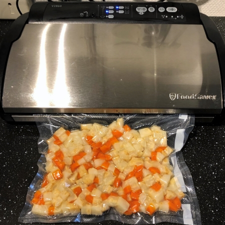 Diced veggies in a vacuum bag.