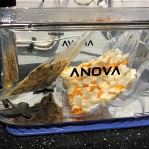 Veggies and mussels reheating in the sous vide.