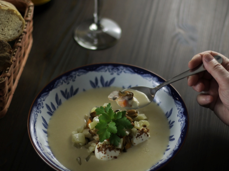 Tasting the mussel soup.